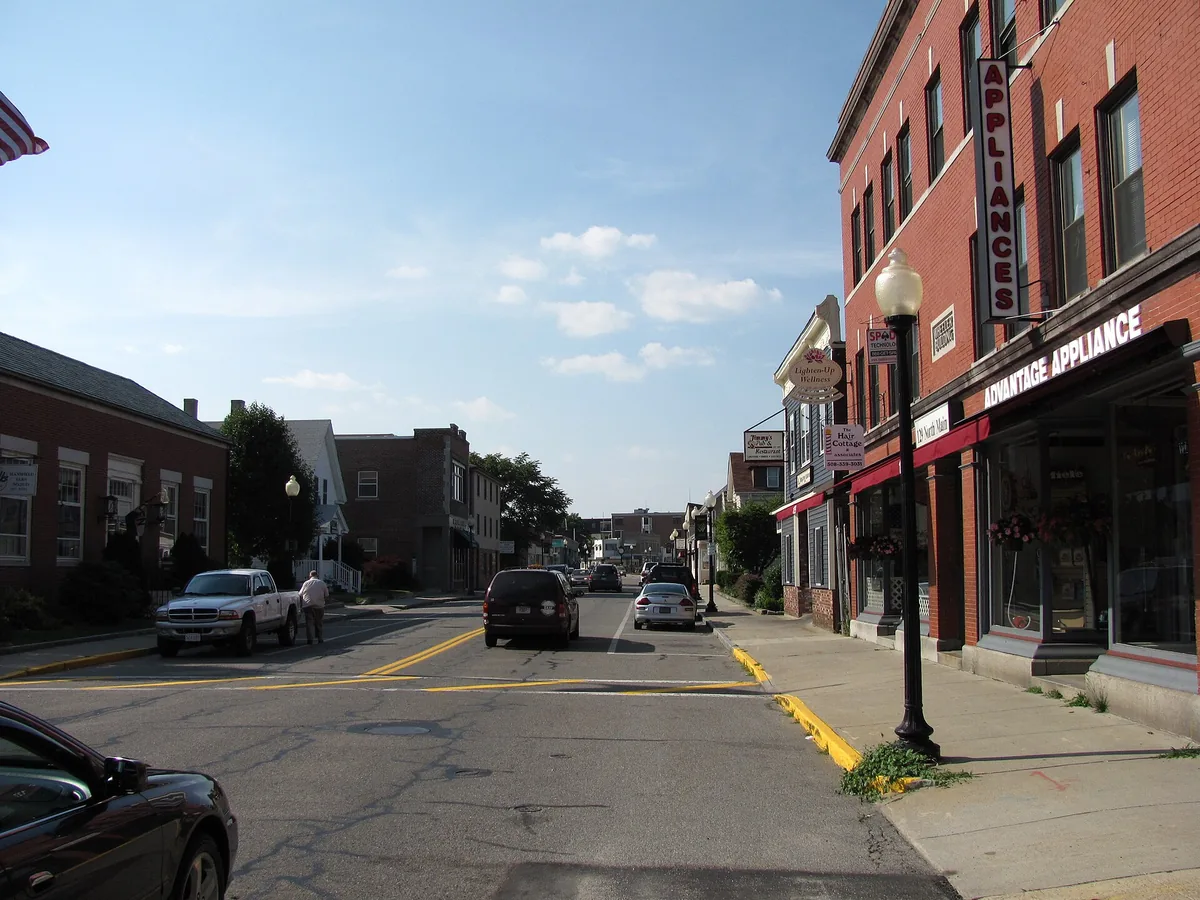 A Mansfield, Massachusetts street lined with brick and clapboard buildings